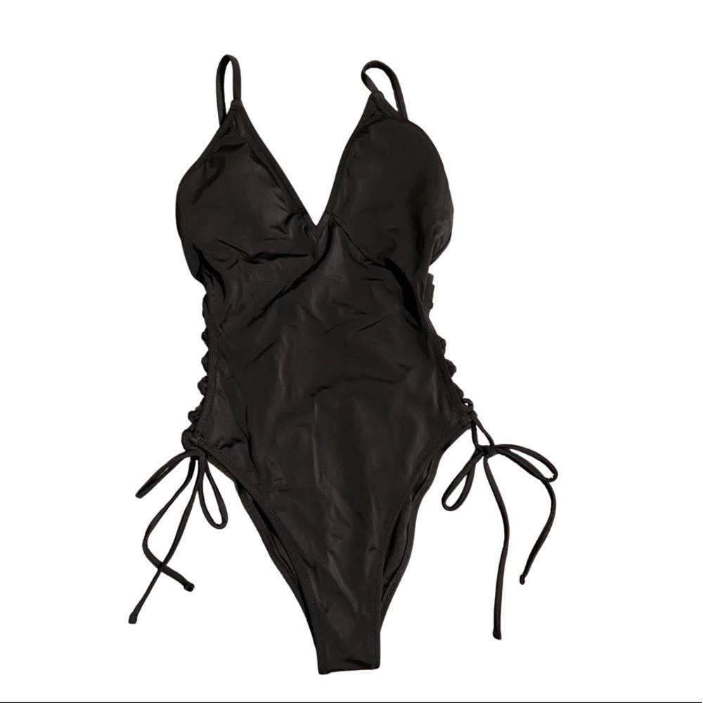 NWT sexy one piece with side cutouts and cross cross tie detail